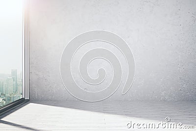 Empty loft room with blank concrete wall and big window Stock Photo