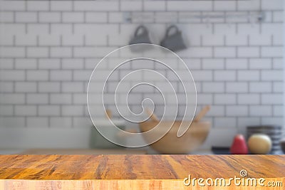 Empty long modern wooden counter on blurred kitchen room Stock Photo