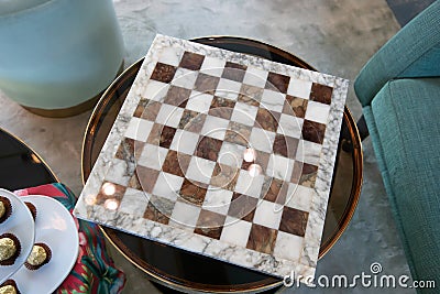 Empty marble chessboard on glass table Stock Photo