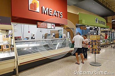 Empty meat display shelves at a Publix grocery store due to the people panicking and hoarding paper and food products Editorial Stock Photo