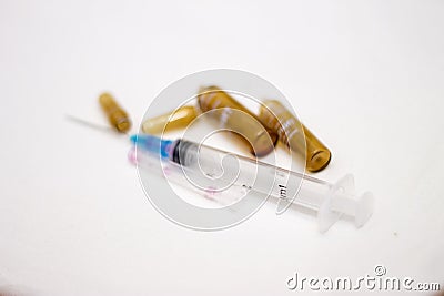 Empty medical ampoules infusion and used syringe after injection isolated on white background Stock Photo