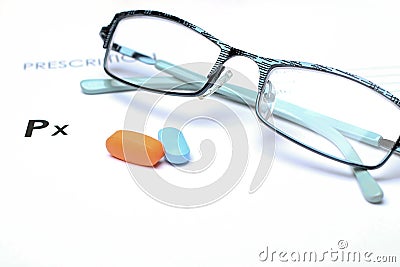 Empty medical prescription with glasses and pills above Stock Photo