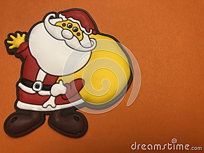 Empty message area with father christmas figure as note paper or message board on orange background Stock Photo