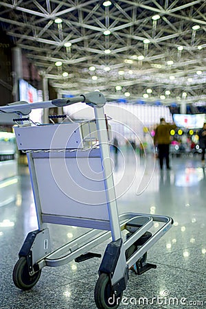 Empty metal cart for luggage standing at airport Stock Photo