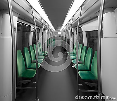 An empty metro interior without people. The seats are on both sides. Stock Photo