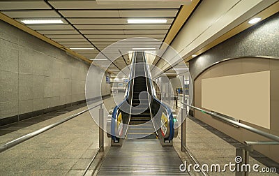 Empty modern escalator at subway station. Electric system moving staircase. Floor and step level. Transportation in underground Stock Photo