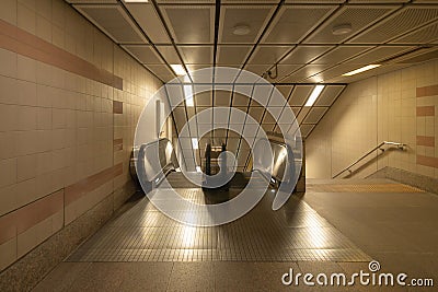 Empty modern escalator at subway station. Electric system moving staircase. Floor and step level. Transportation in underground Stock Photo