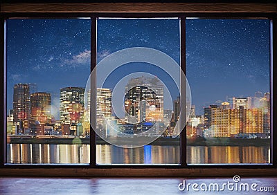 Empty modern interior space with city view at night and starry sky Stock Photo