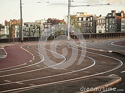 Empty morning street of Amsterdam city, before traffic on sunrise Stock Photo