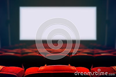 Empty movie cinema seat with blank white screen Stock Photo