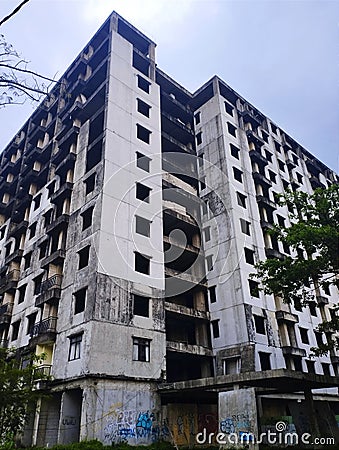 an empty multi-storey apartment building that is not under construction. worrying and lonely conditions and a creepy atmosphere Editorial Stock Photo