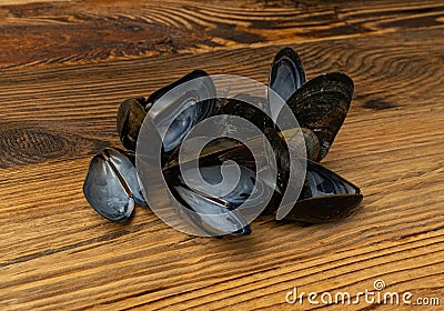 Empty Mussels Shell, Black Clams Shells, Eaten Mollusc, Shellfish, Mussel on Wood Background Top View Stock Photo