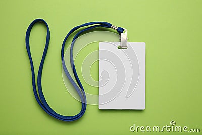 Empty name tag with white strap, mockup on green background Stock Photo
