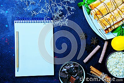 Empty note book with pastries and chocolates, copy space, template, Stock Photo