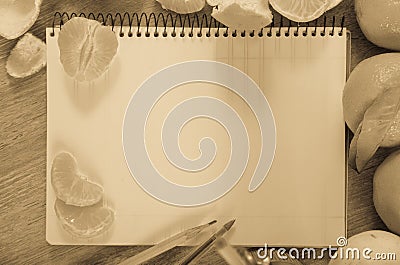 Empty notebook pages and tangerines Stock Photo