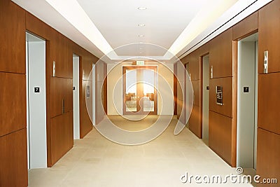 Empty office corridor by elevators on 7th floor of building Stock Photo
