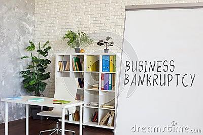 Empty office and words Business bankruptcy on the whiteboard. Stock Photo