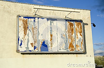 Empty old grunge advertising panel on city house wall Stock Photo