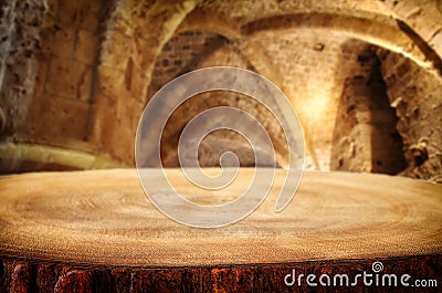 Empty old table in front of ancient knight stone tower. Useful for product display montage. Stock Photo