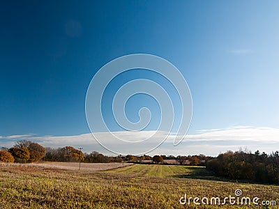 Empty open grass land farm land scene plain agriculture blue sky Stock Photo