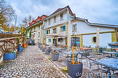 Empty outdoor dining of the restaurant in a rainy day, on March 31 in Bern, Switzerland Editorial Stock Photo