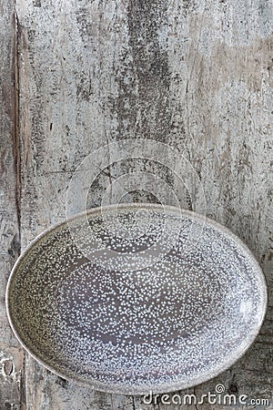 Empty Oval Dish over Rustic Timber Top View Stock Photo