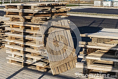 Empty pallets at a construction site. Reuse of wooden pallets in construction Stock Photo