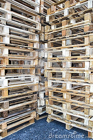 Empty pallets stacked in a warehouse Stock Photo