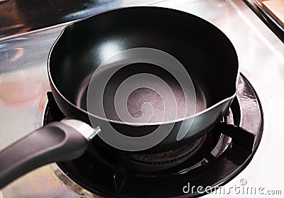 Empty pan on the stove , preparing for cooking. Stock Photo