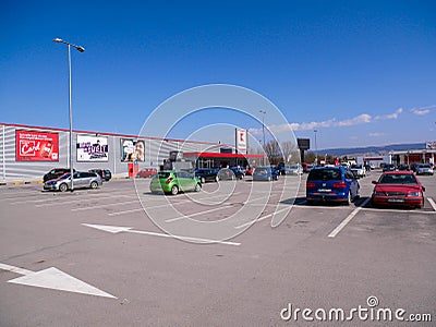 Empty parking lot at the grocery store after governments restrictions during the Coronavirus pandemic. Editorial Stock Photo