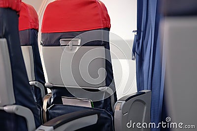 Passenger seat inside airplane. chair in aircraft Stock Photo