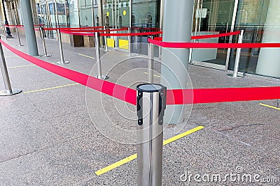 Empty paths bounded by a red ribbon. Tape security at the airport Stock Photo