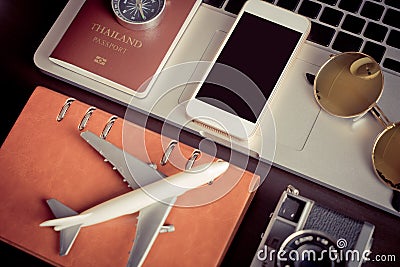 Empty phone screen mock up on travel blogger working desk Stock Photo