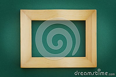 Empty picture frame on a green wall Stock Photo