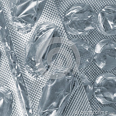 Empty pill blister background, multiple emptied tablet blisters silver texture pattern close-up, large detailed vertical textured Stock Photo