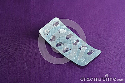 Empty pill blister pack on a Purple background Stock Photo