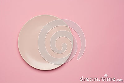 Empty pink plate on the pastel pink background. Flat lay, top view. Stock Photo