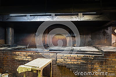 Empty pit room of old Texas BBQ Meat Market in West Texas, Ameri Stock Photo