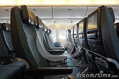 Empty plane cabin seat with green uphostery Stock Photo