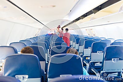 Empty plane interior with few people Editorial Stock Photo