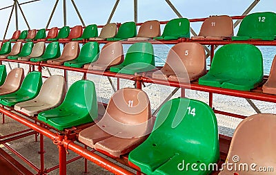 Plastic chairs in the stadium. Stock Photo