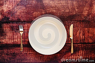 Empty plate with cutlery, top view, concept of intermittent fasting diet to lose weight Stock Photo