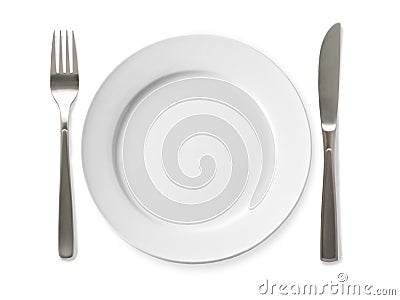 Empty plate with knife and fork on a white background. Stock Photo