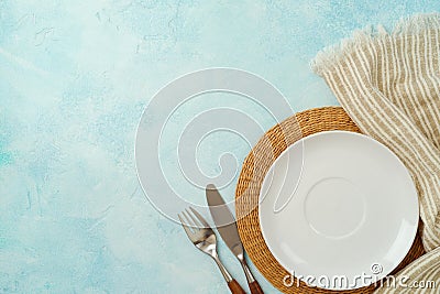 Empty plate with tablecloth and silverware. Mock up background for display. Top view, flat lay Stock Photo