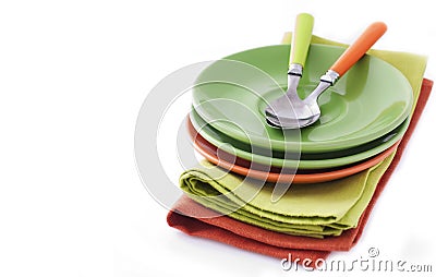 Empty plates and spoons in textile napkin Stock Photo