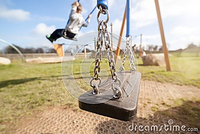 Empty playground swing Stock Photo