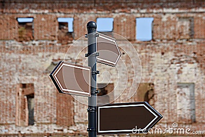 empty pointer on the background of the old ruined manor. copy space Stock Photo