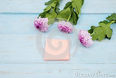 Empty post it paper with pink gerbera flower Stock Photo