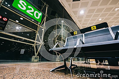 Empty Priority seats, chairs in the airport hall near departure gate at international airport reserved for disability Stock Photo