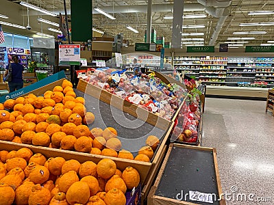 Empty produce department shelves at a Publix grocery store due to the people panicing and hoarding paper and food products Editorial Stock Photo